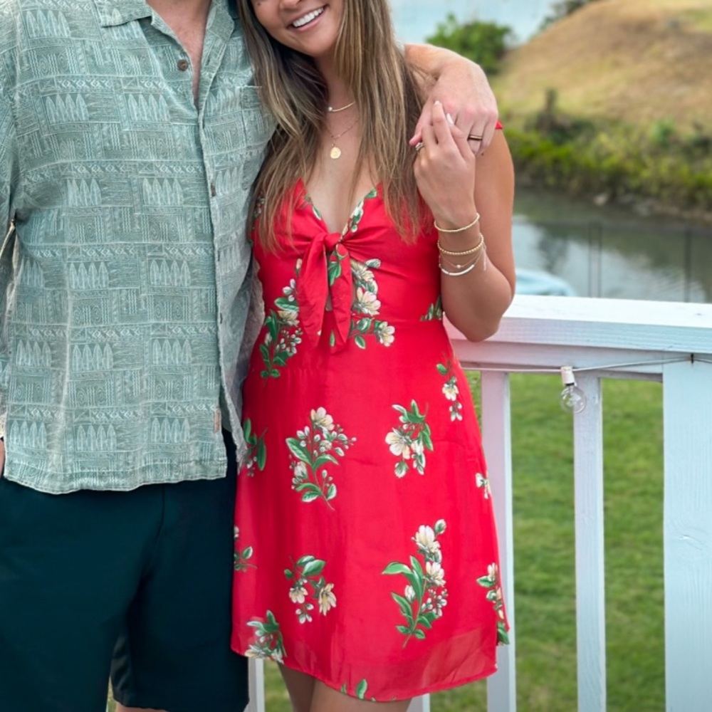 Red sundress with floral designs. Worn once. Brand is Sage the label